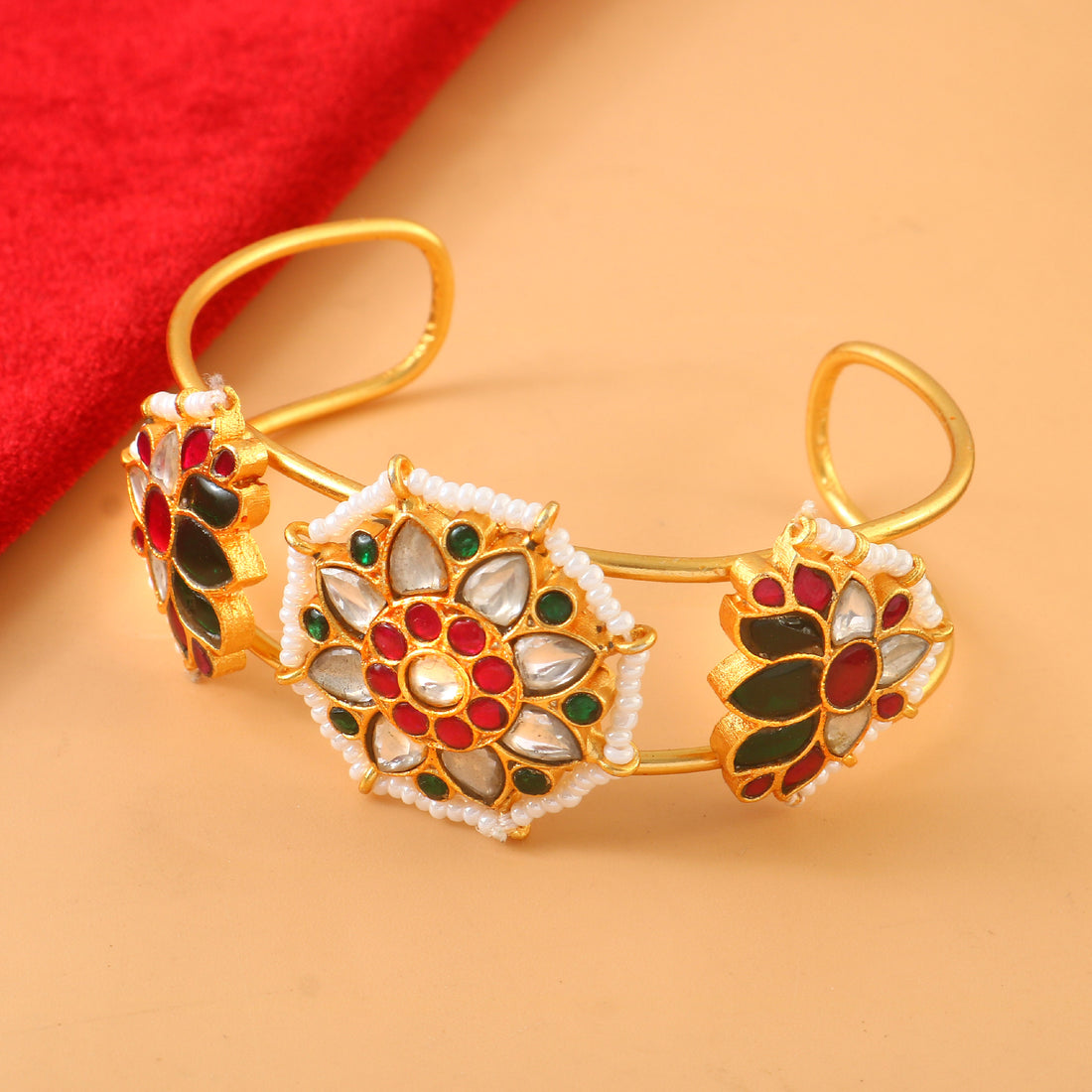 Gold Kundan Bangle with Intricate Floral Design Featuring Red, Green, and White Stone Accents