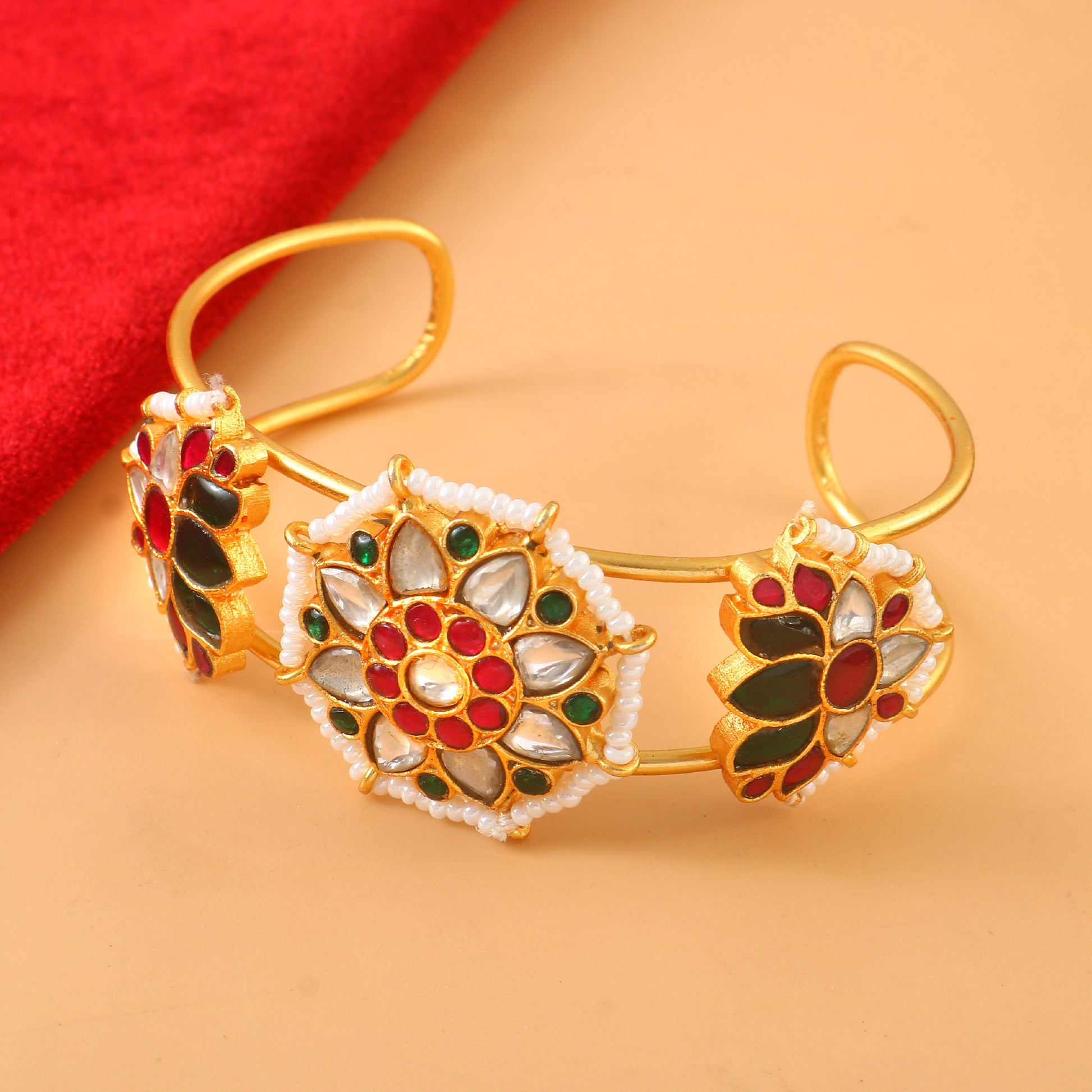 Gold Kundan Bangle with Intricate Floral Design Featuring Red, Green, and White Stone Accents