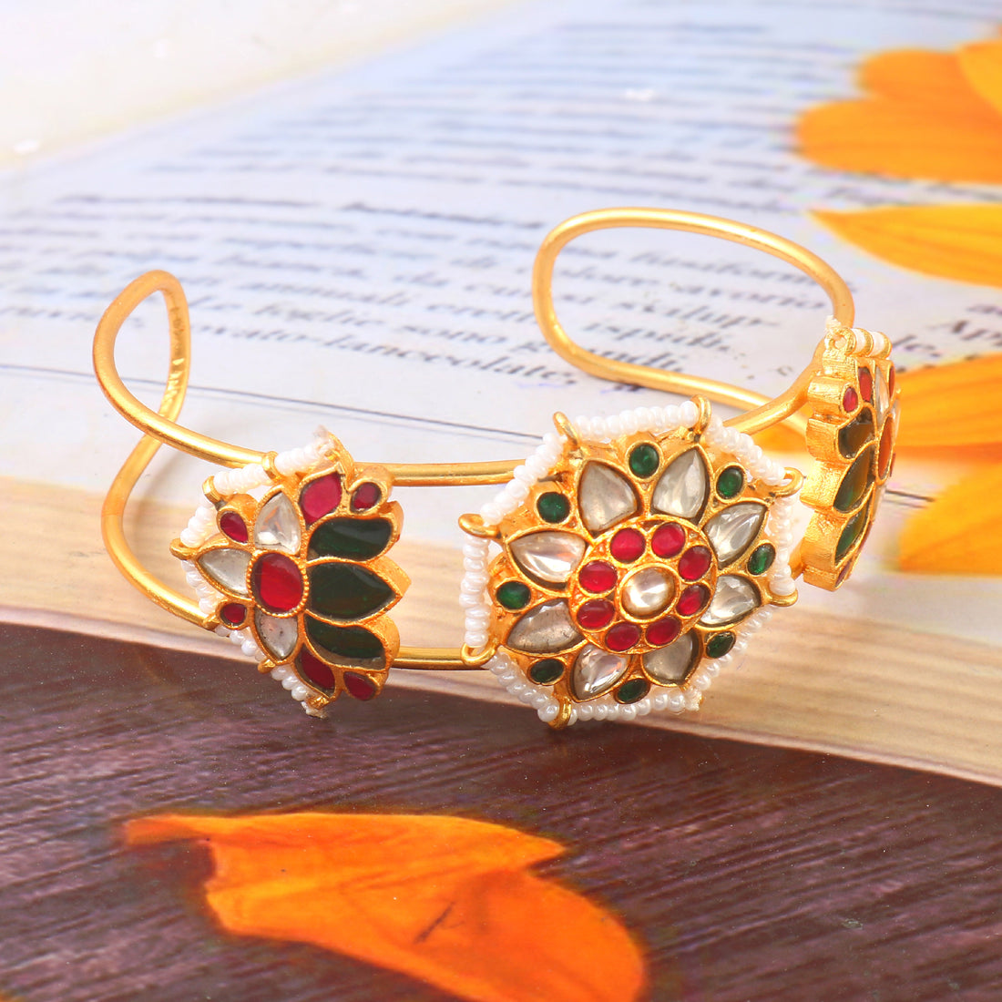 Gold Kundan Bangle with Intricate Floral Design Featuring Red, Green, and White Stone Accents