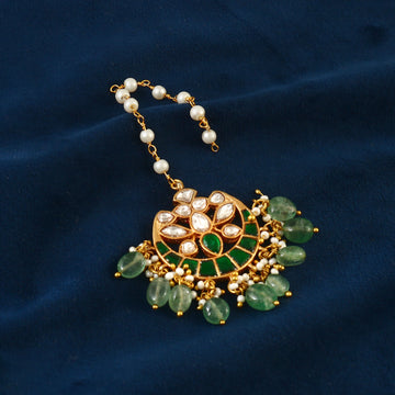 Kundan Maang Tikka with Intricate Gold Design and Green Beads